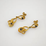 Vergoldetes Schmuckset mit neun edlen Saphiren in Brilliantschliff