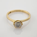 Schlanker Goldring mit rundem Diamant in zarter Weißmetallfassung und Goldperlendetails im Vintage-Stil