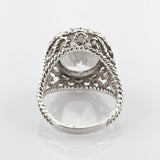Silberner Ring mit verdrehten Seilmustern und großem klarem facettiertem Stein in Kronenfassung
