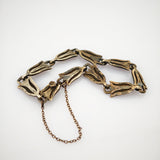 Vintage-Armband aus goldfarbenen tulpenförmigen Metallgliedern mit Kettenschloss